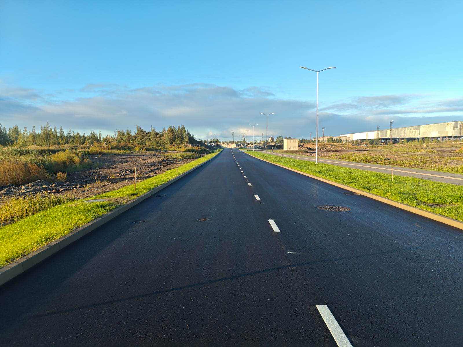 Road base preparation works on an active construction site